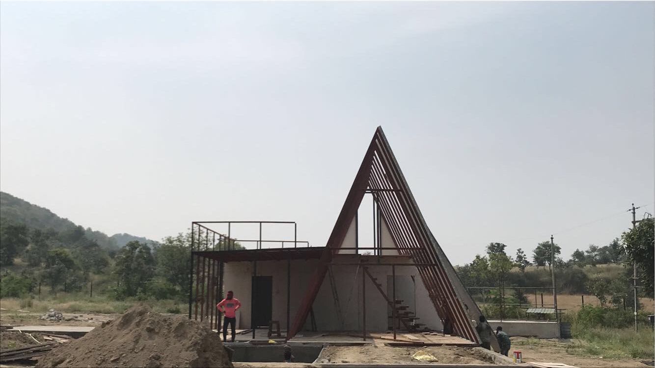 Cozy A-frame bedroom triangular ceiling
